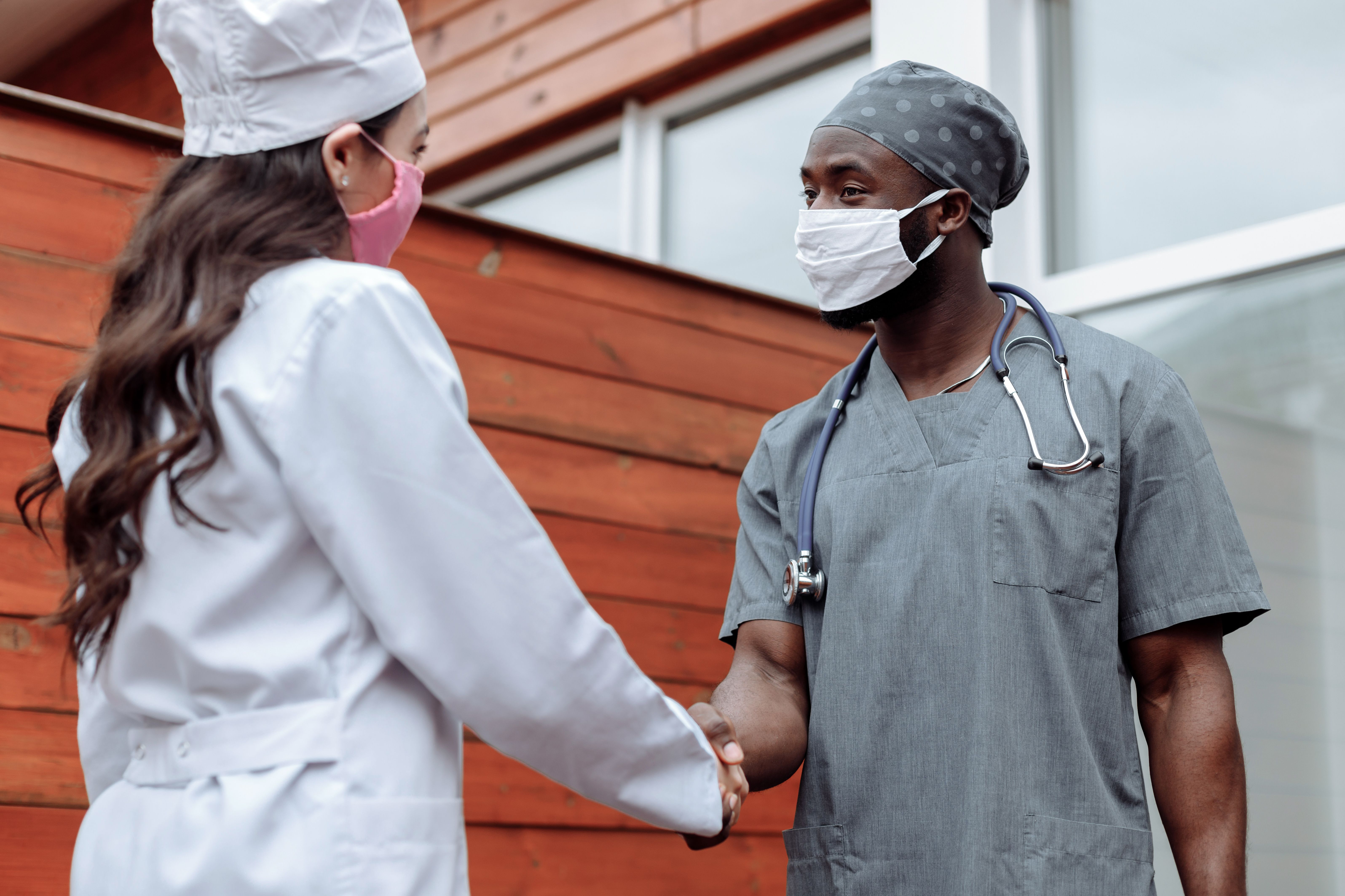 Healthcare professionals shaking hands
